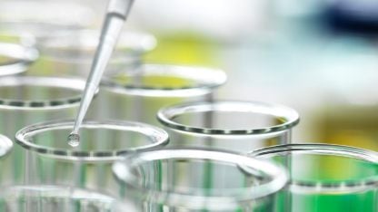 Several test tubes with a pipette, focused on genotoxic impurity analysis for ensuring pharmaceutical safety and quality.