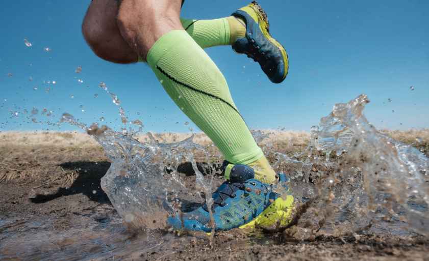Sport running man in cross country trail run