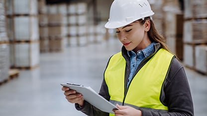 Worker with PPE in warehouse environment