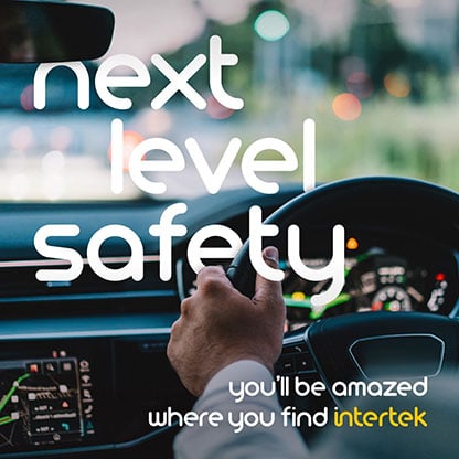 Hand on car steering wheel