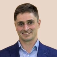 A professional headshot of Luke Gwenter