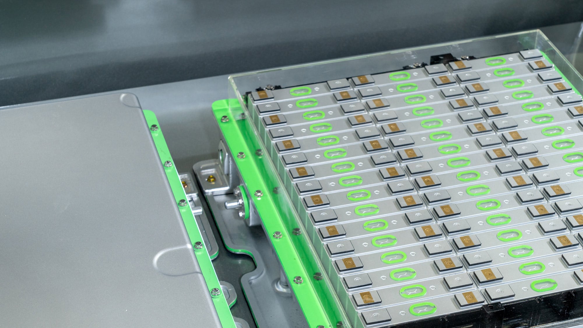 A machine featuring green and white components, showcasing a modern design and industrial functionality.